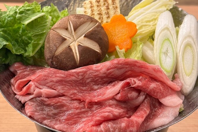the SUMO show with Dinner - Sukiyaki, chanko soup, and the dinner setup